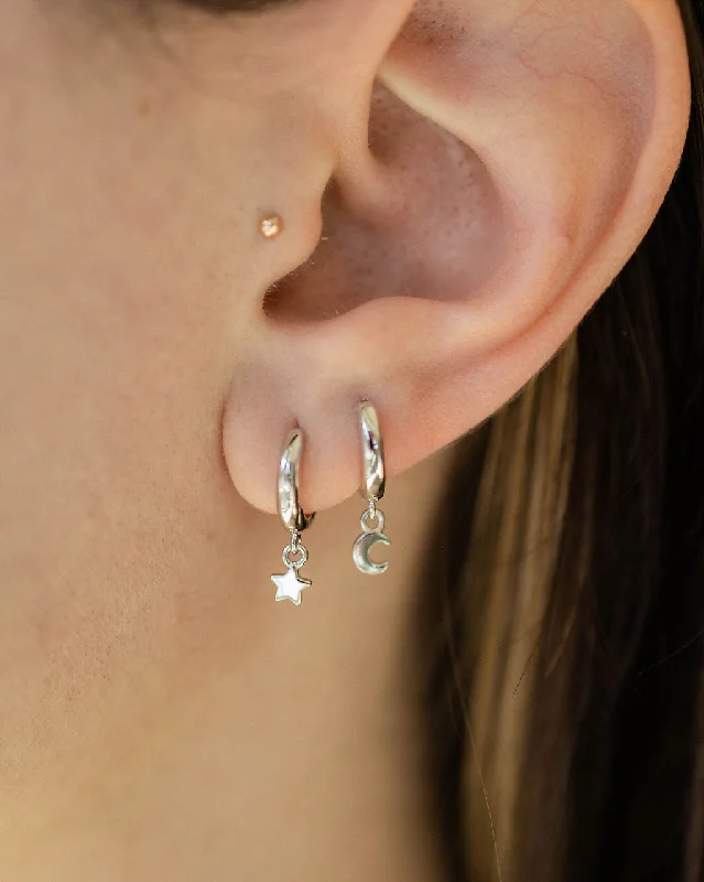 women's hexagon earrings -Star and Moon Huggie Hoop Earrings in Silver